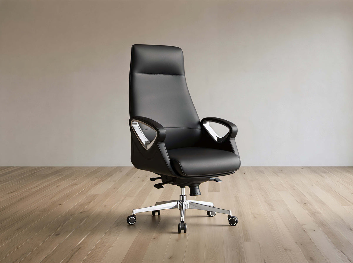 A black leather high-back office chair with chrome armrest supports and a five-star wheeled base, set against a minimalist beige wall and light wood floor.