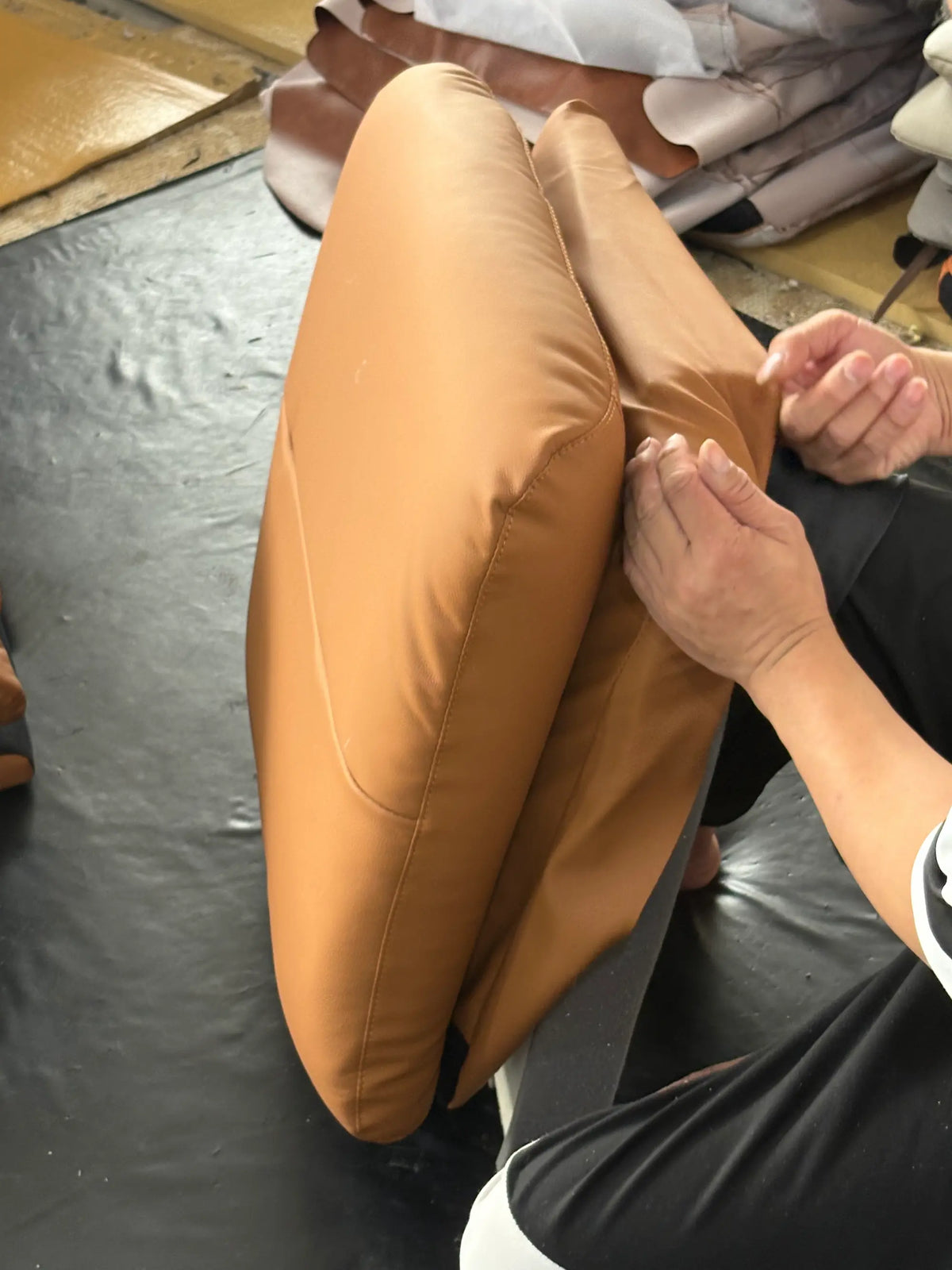 Load video: Our craftsmen carefully align and press each seat cushion onto the chair frame by hand — ensuring a perfect fit, clean edges, and a finished look that meets our quality standards.
