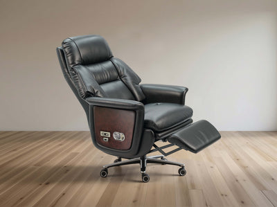 Black leather recliner chair on a wooden floor with a neutral wall background