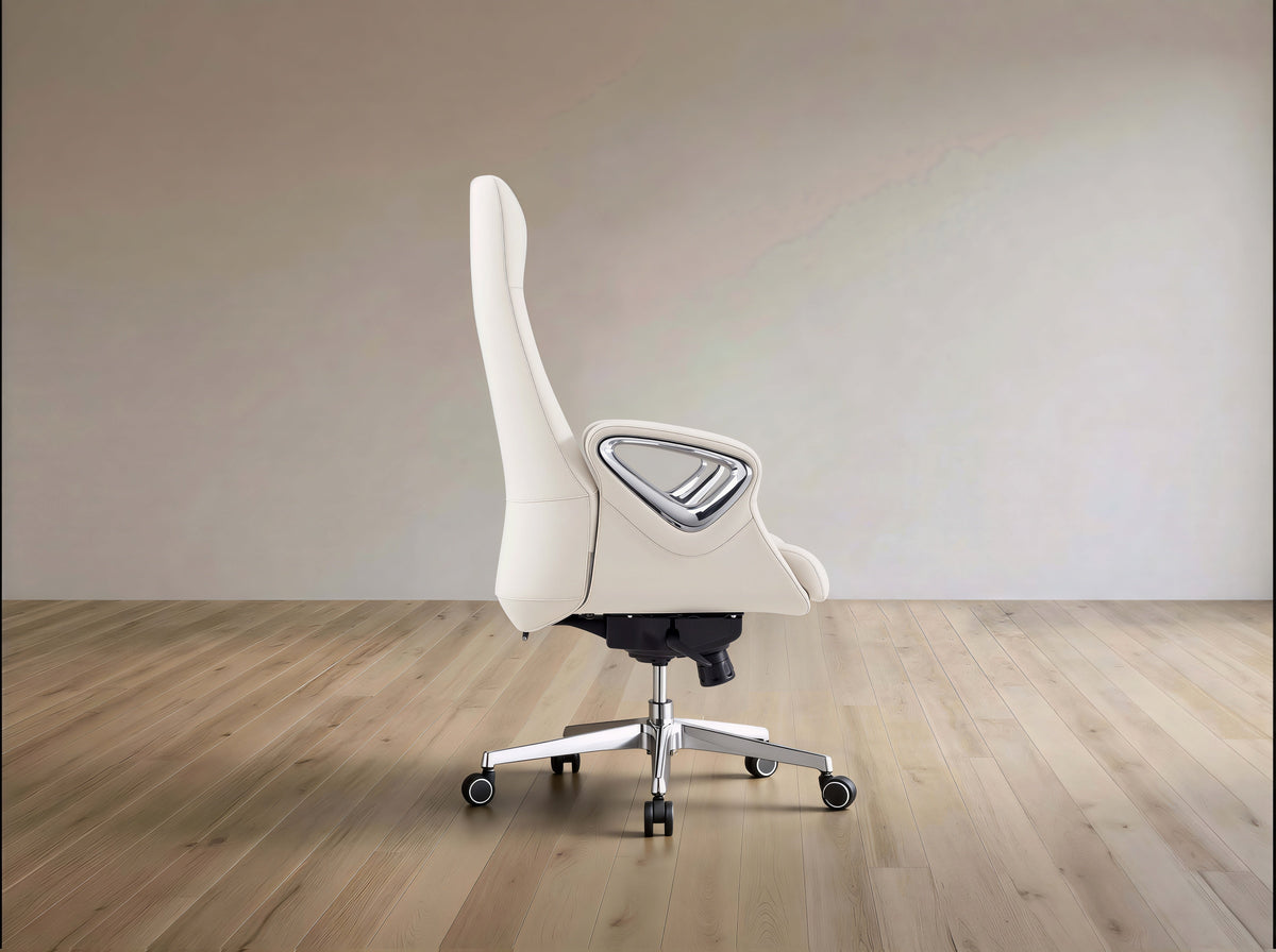 A modern off-white gaming chair with a high backrest, silver armrest frame, and chrome five-star base on a light wood floor against a neutral beige wall.