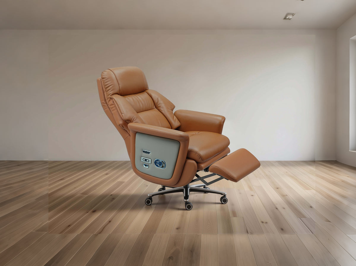 A tan leather recliner chair with an extended footrest and a light gray side control panel, set on a wood floor against a neutral beige wall.