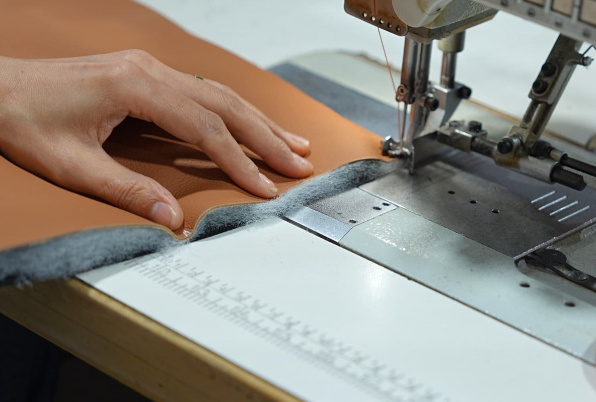 Load video: Our skilled sewers use industrial sewing machines to stitch and secure each foam layer in place — ensuring the padding stays perfectly shaped for lasting comfort.