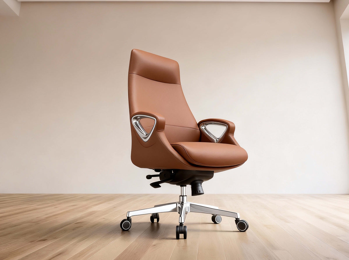 A modern brown leather office chair with chrome armrests and a five-star wheeled base, set against a minimalist beige wall and light wood floor.