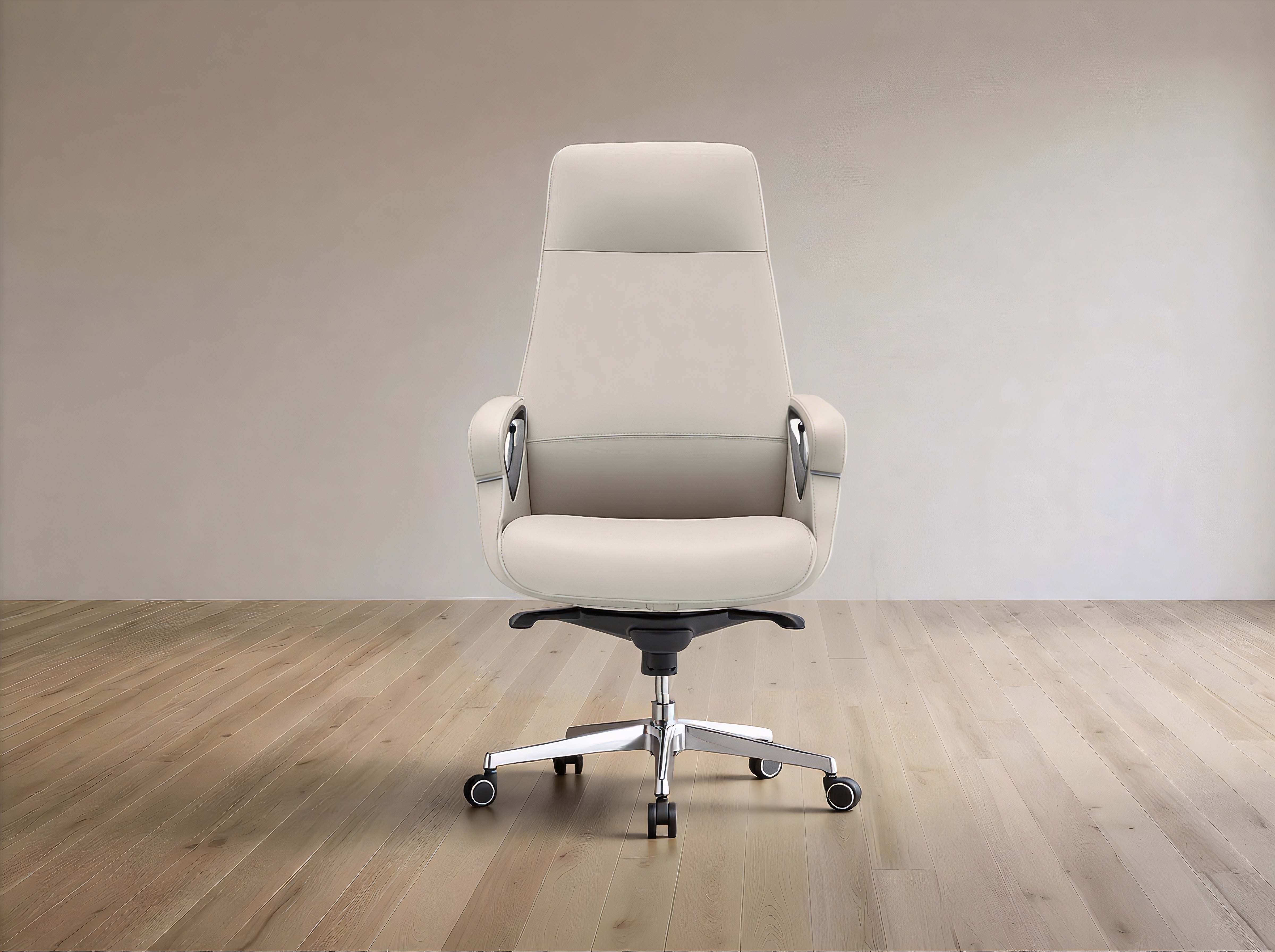 A modern off-white leather office chair with a high back, armrests, and a chrome five-star base with casters, set against a minimalist beige wall and light wood floor.