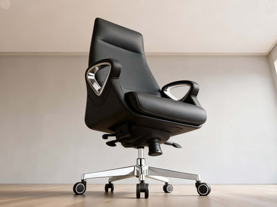 A black leather office chair with a high back, chrome armrest supports, and a five-star metal base with casters, shown in a minimalist room setting.