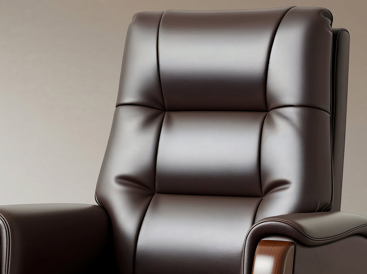 A close-up of a dark brown leather recliner chair with padded segmented backrest and armrests, shown against a plain warm beige background.